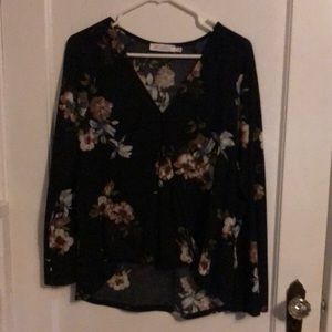 Black flowery blouse. Comfortable, deep v neck.